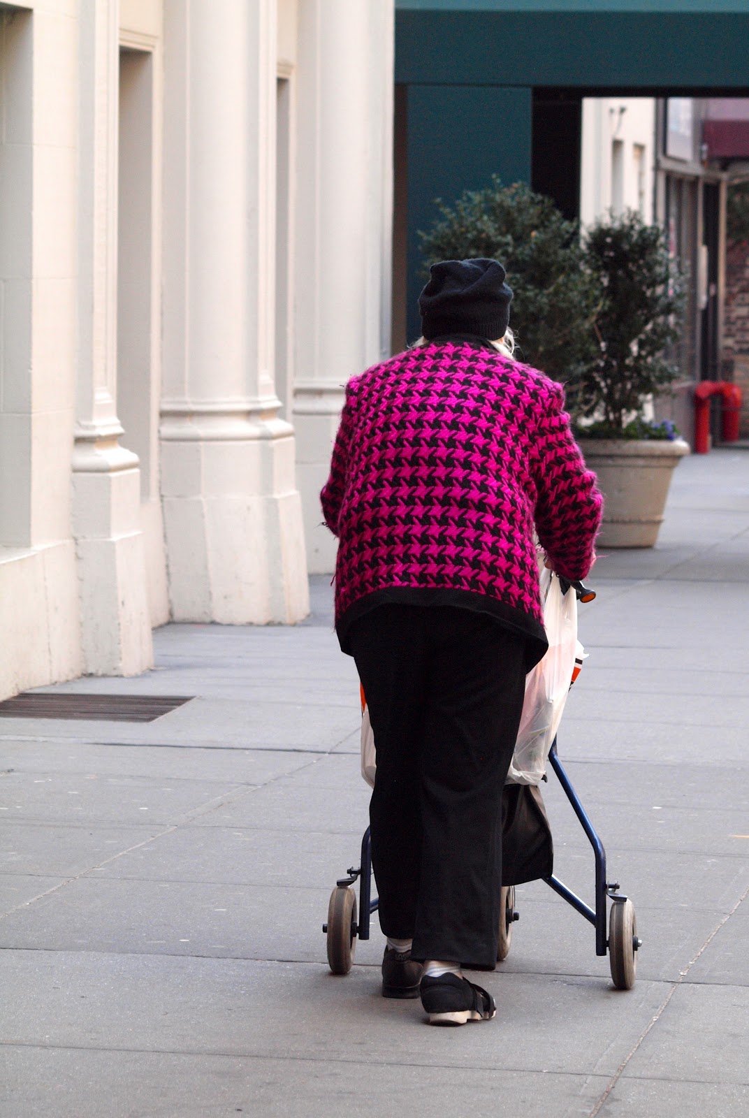 Out and About NYC, older woman walking with stroller